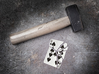 Image showing Hammer with a broken card, nine of spades