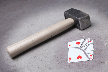 Image showing Hammer with a broken card, two of hearts
