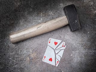 Image showing Hammer with a broken card, two of hearts