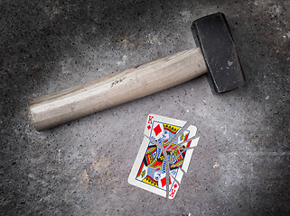 Image showing Hammer with a broken card, king of diamonds