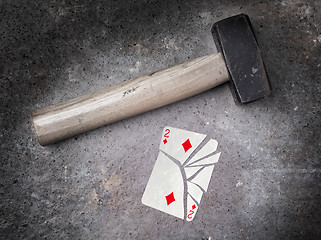 Image showing Hammer with a broken card, two of diamonds