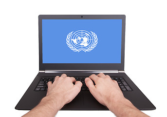 Image showing Hands working on laptop, United Nations