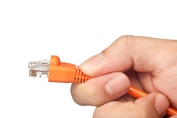 Image showing Hand plugging a network cable