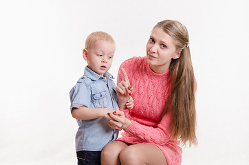 Image showing Mom scolds three year old boy