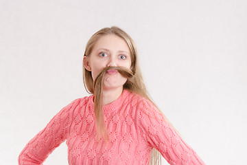 Image showing Cheerful girl mustache made a lock of hair