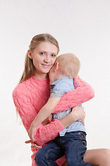 Image showing Joyful mother calms her son