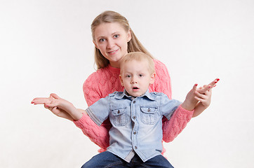 Image showing Mom sat holding hands with his son