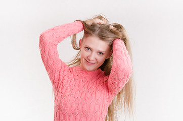 Image showing Happy girl holding her hair