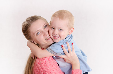 Image showing Young girl hugging a boy