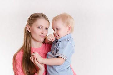 Image showing Mum with the son of three-year hold on handle