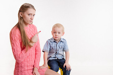 Image showing Mom scolds boy