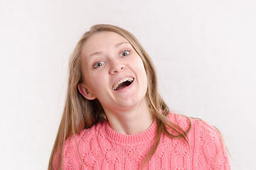 Image showing Portrait of the laughing girl on a light background