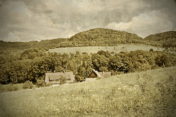 Image showing country idyll with old farmhouse and hill