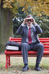 Image showing Businessman searching with binoculars