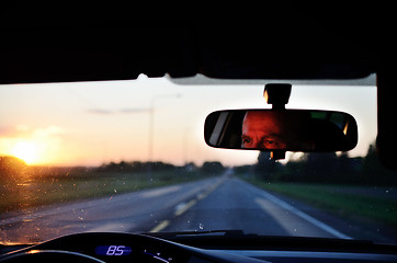 Image showing reflected in the mirror of car driver