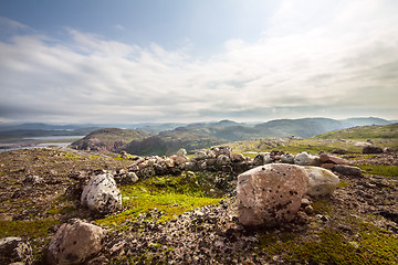 Image showing polar tundra and stone heaps  human ancient