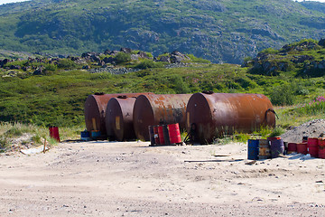 Image showing gas station in mountains i Arctic with barrels