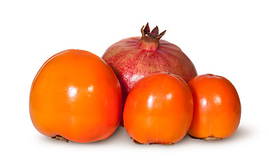 Image showing Three Persimmon And One Pomegranate Fruit