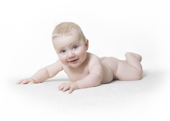 Image showing Naked baby laughs into the camera