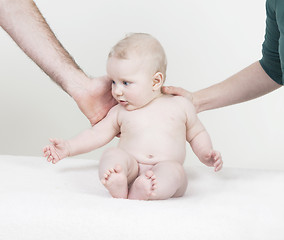 Image showing baby is supported by arms