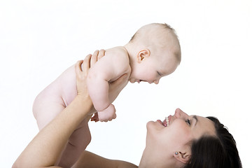 Image showing Mother holds her baby high