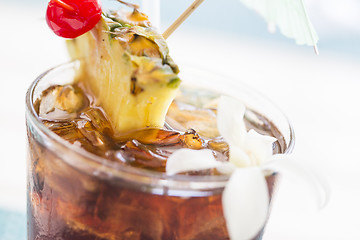 Image showing Ice Cold Mai Tai Cocktail Drink with Fruit and Umbrullas