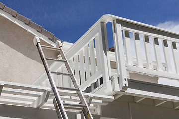 Image showing Construction Ladder Leaning on White House Deck
