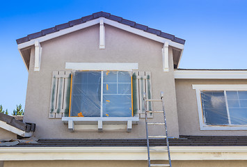 Image showing Ladder Leaning Up Against A House Ready For New Paint