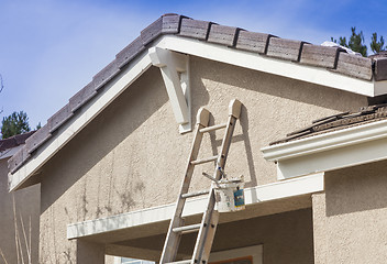 Image showing Ladder Leaning Up Against A House Ready For New Paint