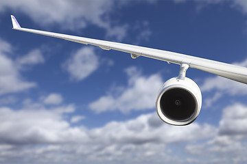 Image showing Airplane Wing Against Clouds