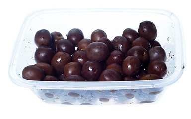 Image showing olives in plastic box surface isolated