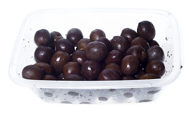 Image showing olives in plastic box surface isolated