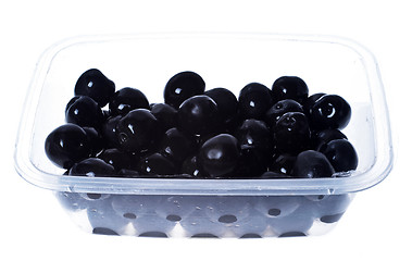 Image showing olives in plastic box surface isolated