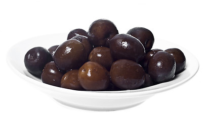 Image showing Brown  olives in bowl isolated 