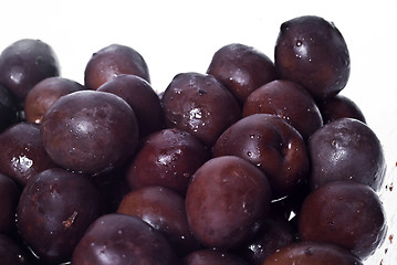 Image showing Brown  olives in bowl isolated 