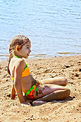 Image showing Girl on sand by the river