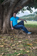 Image showing Man poses outside in the park