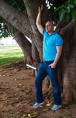 Image showing Man poses outside in the park