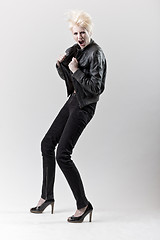 Image showing affective scream blond girl in black leather