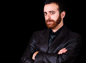 Image showing young businessman portrait on a black background