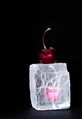 Image showing Frozen sweet cherry on black