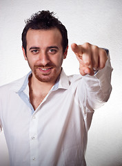 Image showing young man pointing a finger towards you