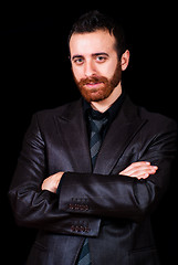 Image showing young businessman portrait on a black background