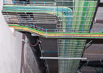 Image showing Multicolored pipes and wires silver vents of industrial faclity