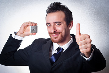 Image showing happy business man going thumbs up