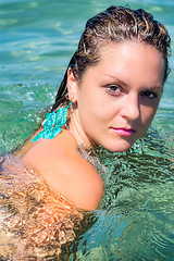 Image showing Beautiful Woman Relaxing in turquoise Water