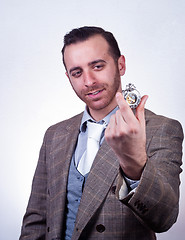 Image showing elegant man looking his old pocket watch