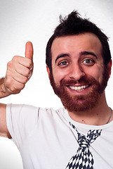 Image showing happy young man showing thumb up sign