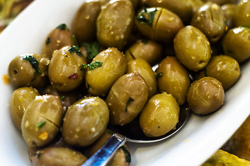 Image showing Marinated green olives in bowl