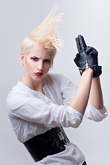 Image showing attractive blond girl with gun